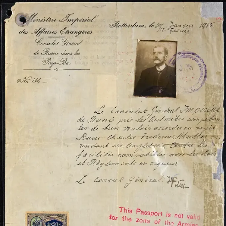 A beige sheet of paper with a passport sized photo attached and stamped sentence in red ink indicating the bearer's movements.