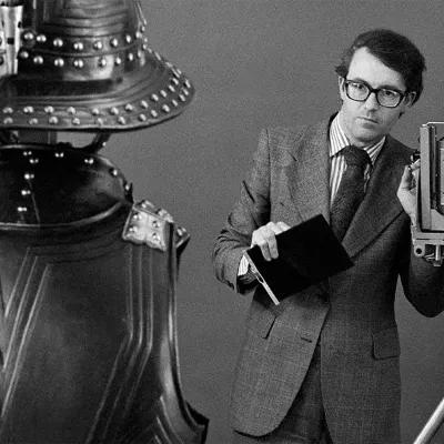 Monochrome image of Jeremy Hall photographing an English Civil War armour