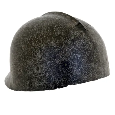 metal helmet wiith round skull a median ridge and flared at hte neck