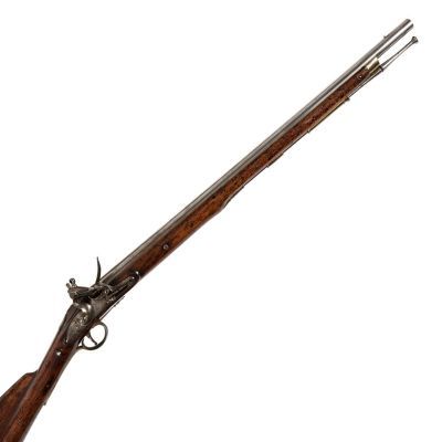 A long barrelled carbine with mottled wood finish, in steel with brass trim