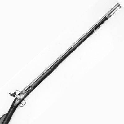 A black and white image of a long barrelled musket with the barrel engraved with a 'GR V' and crowned cross sceptres.