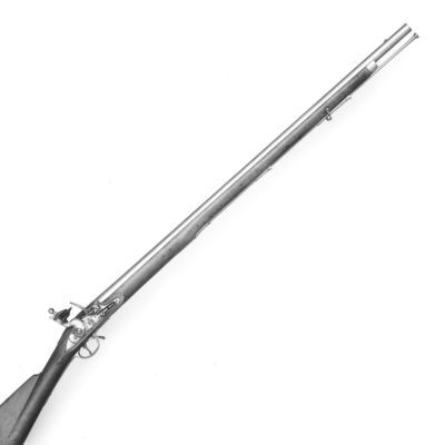 A black and white image of a long barrelled musket finished in wood and iron and stamped with a star, a 'T.A.' and a large Crown. 
