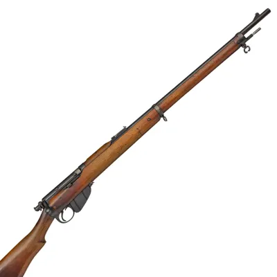 Long barrelled rifle in brown wood and steel with brass finish