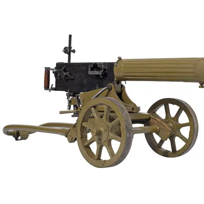 A khaki green Maxim machine gun mounted on a wheel carriage/mount with a raised sight reticule 