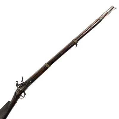 A long barrelled musket with three brass bands around the barrel, finished in wood and iron.