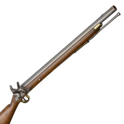 A short barrelled carbine in wood and steel with brass trim