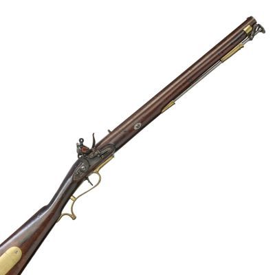 A rifled short barrelled carbine of wood and steel, with brass trim