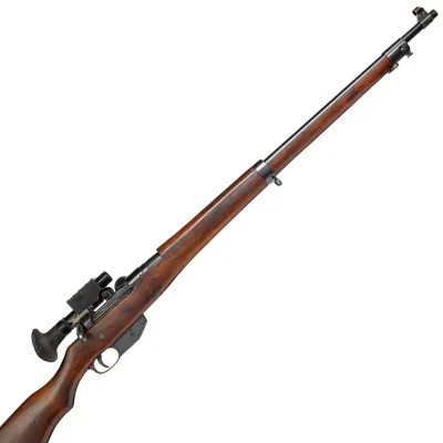 A long barrelled rifle in wood and metal with a sight attachment