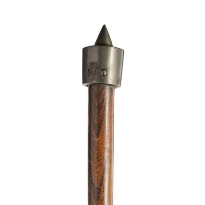 A wooden shaft with a heavy metal ball and spike attached to the head