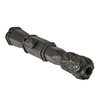 Octagonal bronze tube divided into four sections and featuring two male faces one with a beard next to the end of the barrel and the other clean shaven with open mouth
