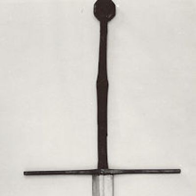 Steel hilted sword with long straight cross guard, octagonal pommel and inlaid symbols of a wolf, a fleur-de-lys, and the letter M.