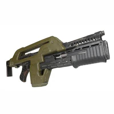 Green and black movie prop rifle from the film Aliens