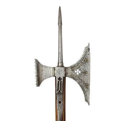 A fish-tail axe head attached to a long, square sectioned pole with a spike on top and serrated hammer on the reverse.