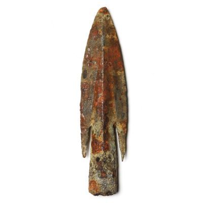 A metal arrowhead with tapering socket for wooden shaft and brazed barbs.