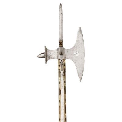 Narrow axe-blade with a rear flat hammer head and a spike on top a decorative pole
