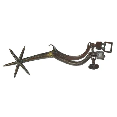 Gilded copper wish-bone shaped bar of metal leading to a spinning, six pronged star at the heel.