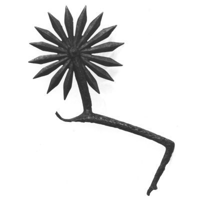 A single arm of a pair of spurs, comprising of a blackened bronze bar leading to a large, spinning, multi-pronged star