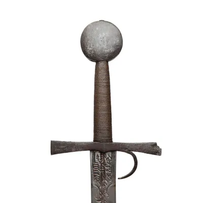 Iron hilted two-edged blade with wooden grip bound with cord and circular pommel
