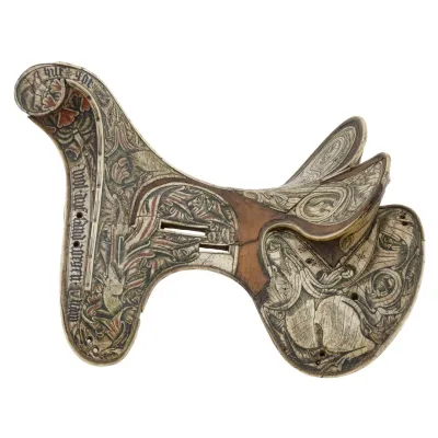 A wooden horse saddle veneered in bone. The bone is intricately decorated with natural pictorials in green, blue, and red. 