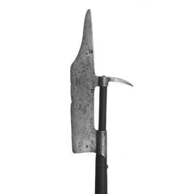 Narrow oblong blade with straight cutting edge which curves back at the top to form a spike