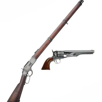 A Winchester rifle and a colt revolver side by side