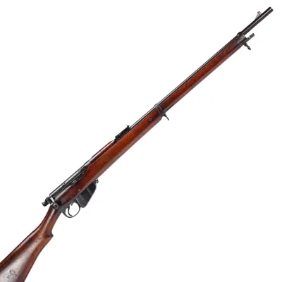 A long barrelled rifle in dark brown wood with dark iron trim and fittings