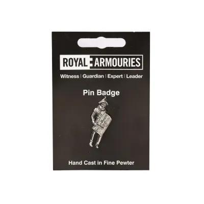 small gladiator pin badge mounted on black card