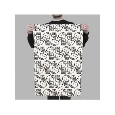 A man proudly holds up a black and white patterned towel, showcasing its unique design