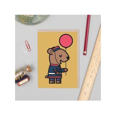 Greetings card with a sketch of a teddy bear dressed in a Victorian military uniform holding a red balloon