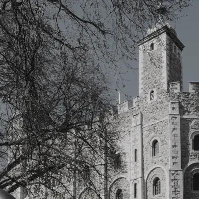 A desaturated image of the parapets of the White Tower at the Tower of London
