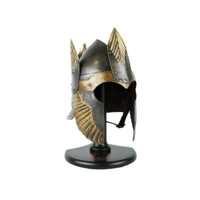 Medieval-style helmet with gold detailing and wing-shaped decorations on each side, displayed on a black stand