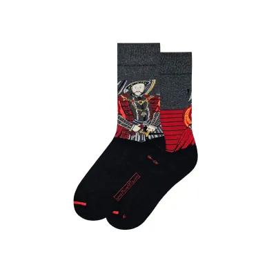 Black socks adorned with a colourful depiction of Henry VIII in ceremonial clothing, accented by gold patterns and labelled with his name