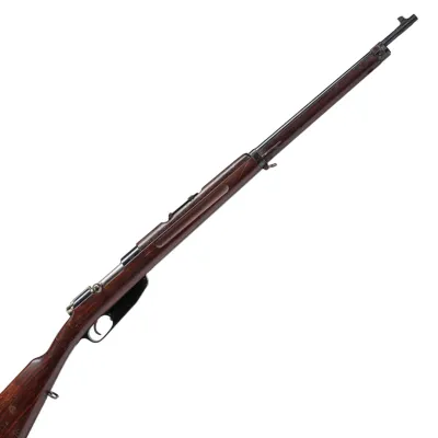 A long barrelled rifles in dark wood and blackened iron or steel trim