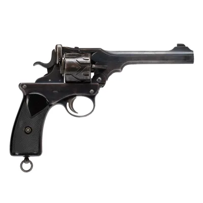 A black bodied metal pistol with cylinder, cocking hammer, and sling ring on handle