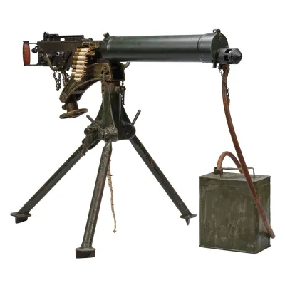 A smooth jacketed machine gun mounted on a tripod with a rubber hose running to a square can