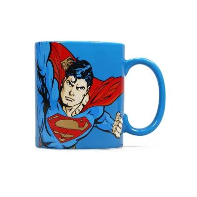 Bright blue mug decorated with a classic Superman design, showing the hero in mid‑flight with his cape sweeping to the side