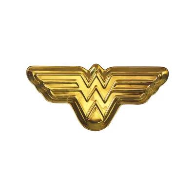 Decorative gold dish featuring the iconic Wonder Woman symbol in a raised, sculpted finish suitable for holding small items