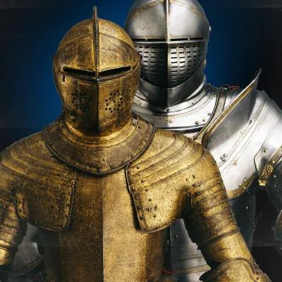 Two suits of royal armour shown side by side. Charles the First and Henry the Eighth.  