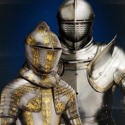 Boy's armour presumably made for Henry, prince of Wales, c.1608, decorated with scenes from the life of Alexander the Great, displayed with the tournament armour of King Henry VIII 