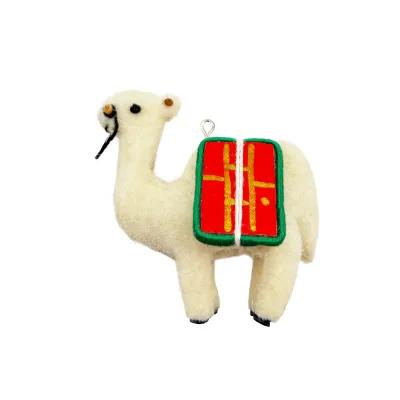 Small felt camel ornament facing left, cream coloured, with stitched facial details and red saddle packs trimmed in