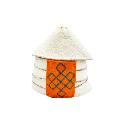 Small white felt yurt with a conical roof and orange felt panel featuring blue geometric embroidery