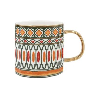 Patterned ceramic mug with colourful geometric motifs in green and orange, accented by a metallic gold handle