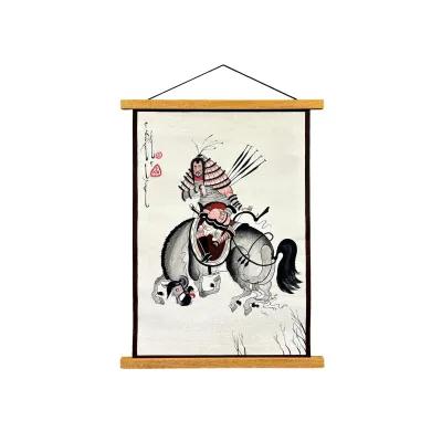 Hanging fabric scroll showing a warrior on horseback with bow and arrows, painted in black, red and grey with calligraphy