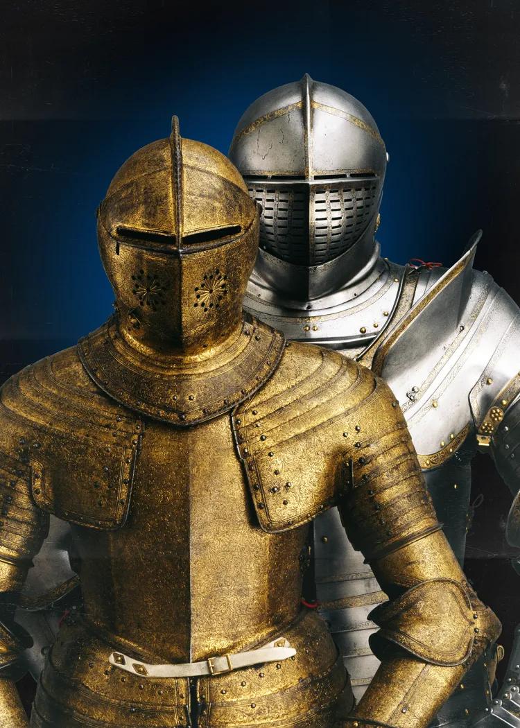 Two suits of royal armour shown side by side. Charles the First and Henry the Eighth.  