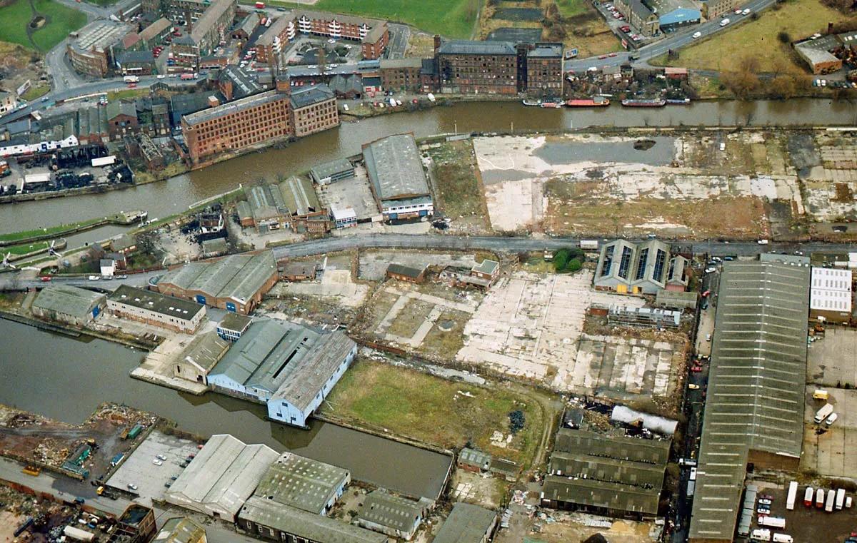 Aerial view of the run down old Clarence Dock industrial area before the Royal Armouries museum was built