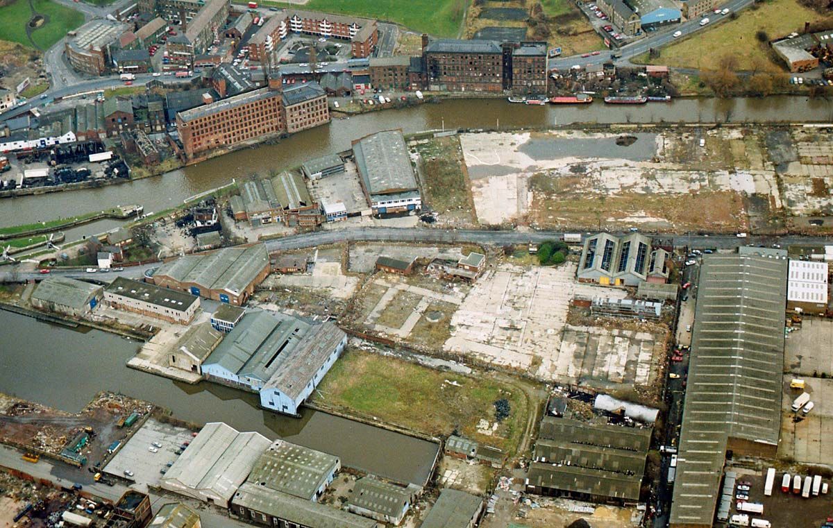 Aerial view of the run down old Clarence Dock industrial area before the Royal Armouries museum was built