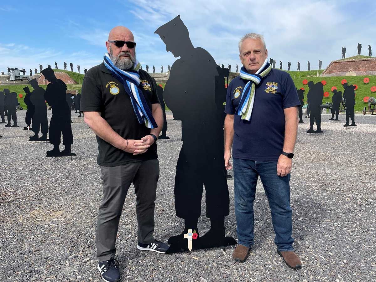 2 Falklands war veterans standing amongst military silhouettes