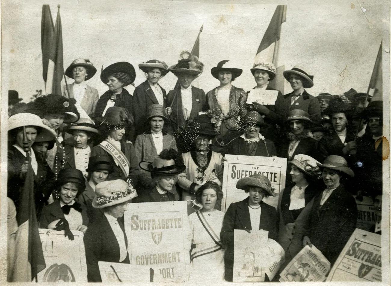 A photograph of a group of smartly dressed women looking determined 
