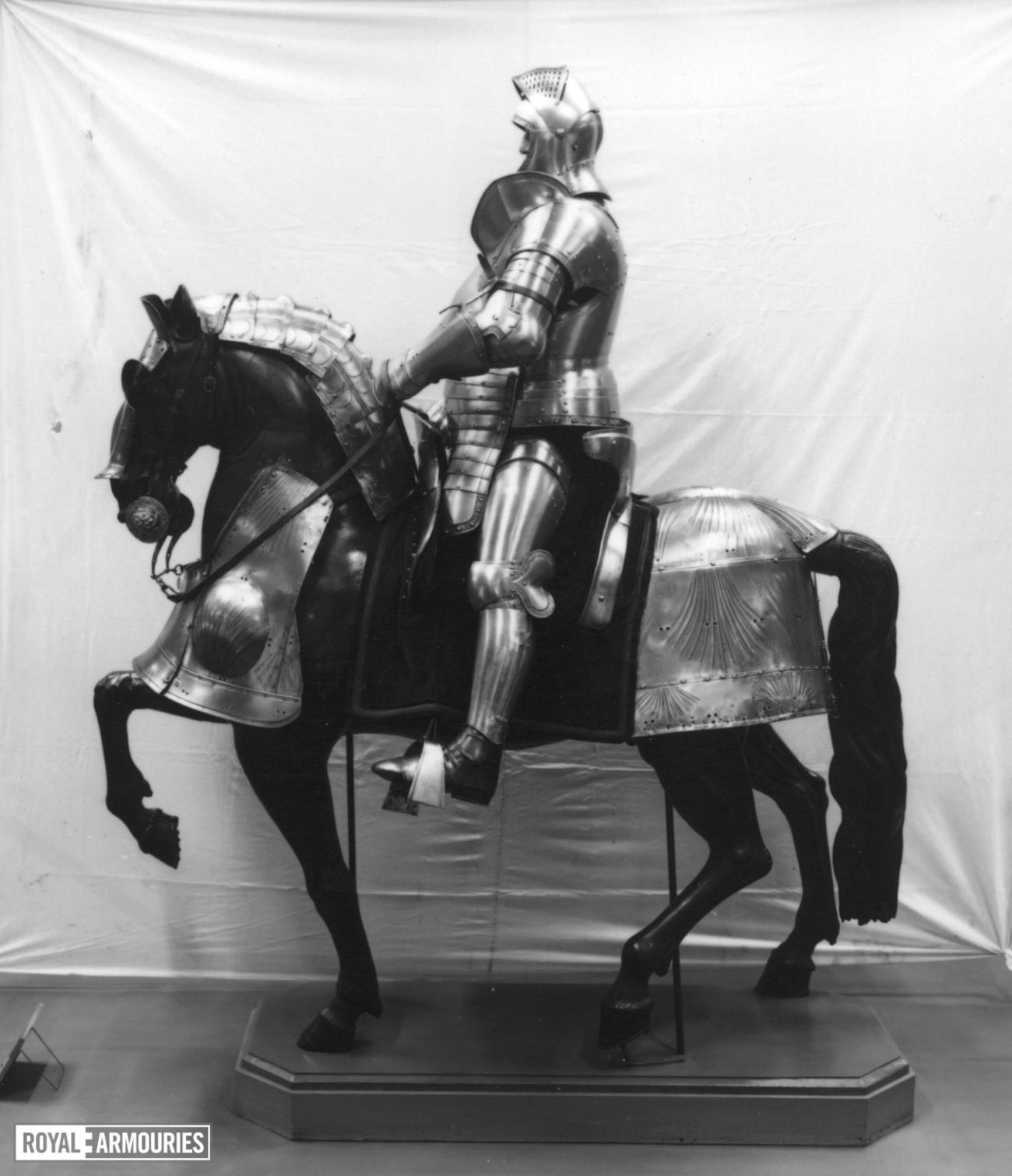 Knight in full armour on horse back