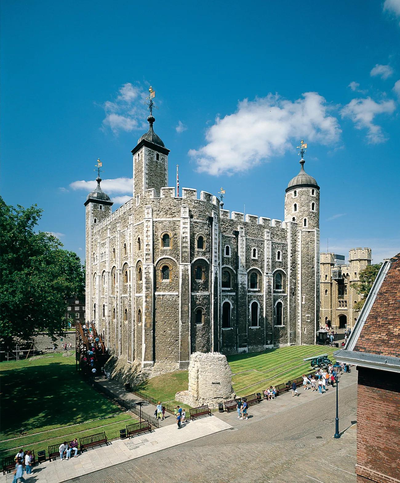 A square stone tower with taller narrow towers at each corner